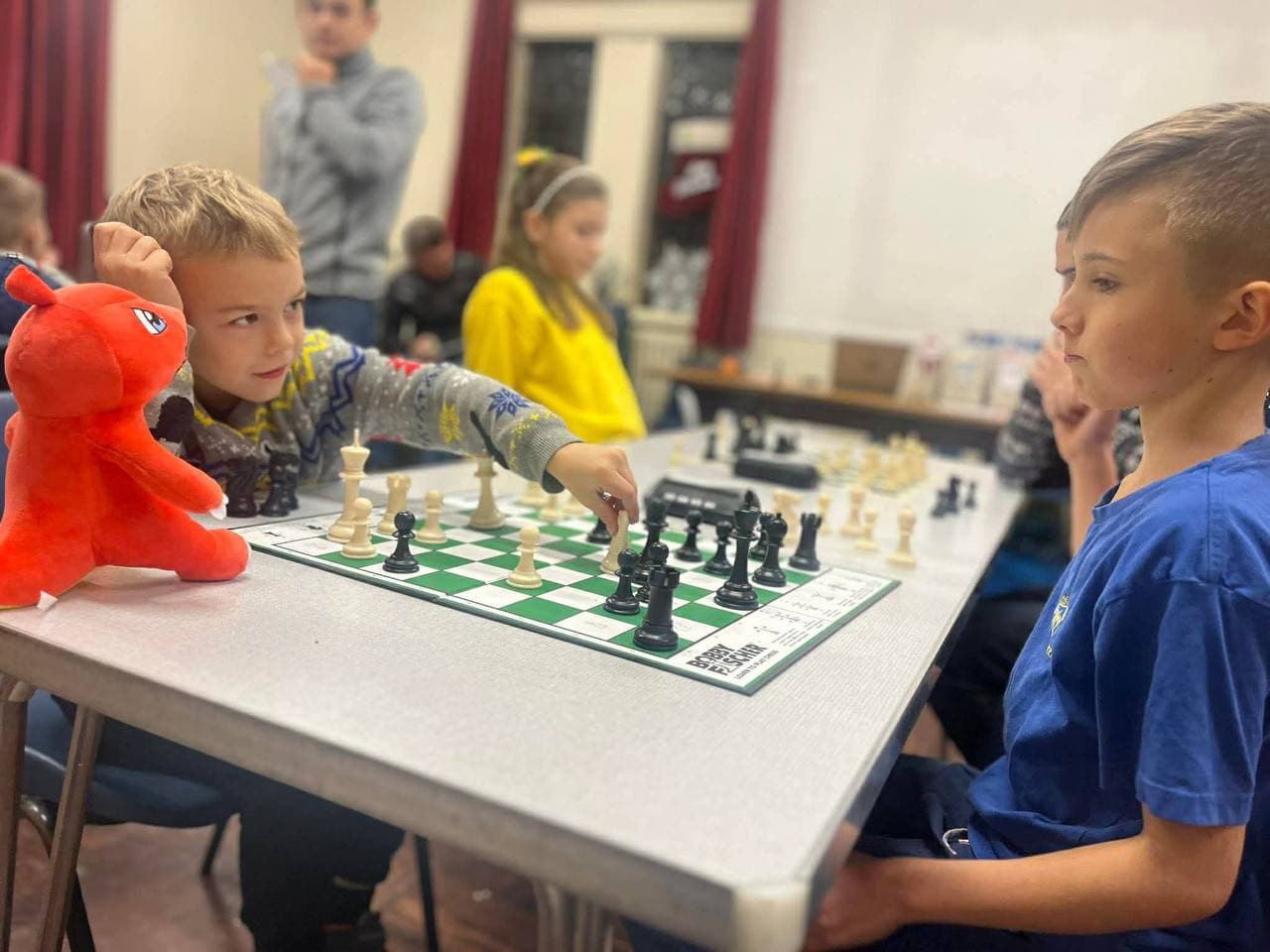 Children learning chess at a Chess4U kids class in Glasgow