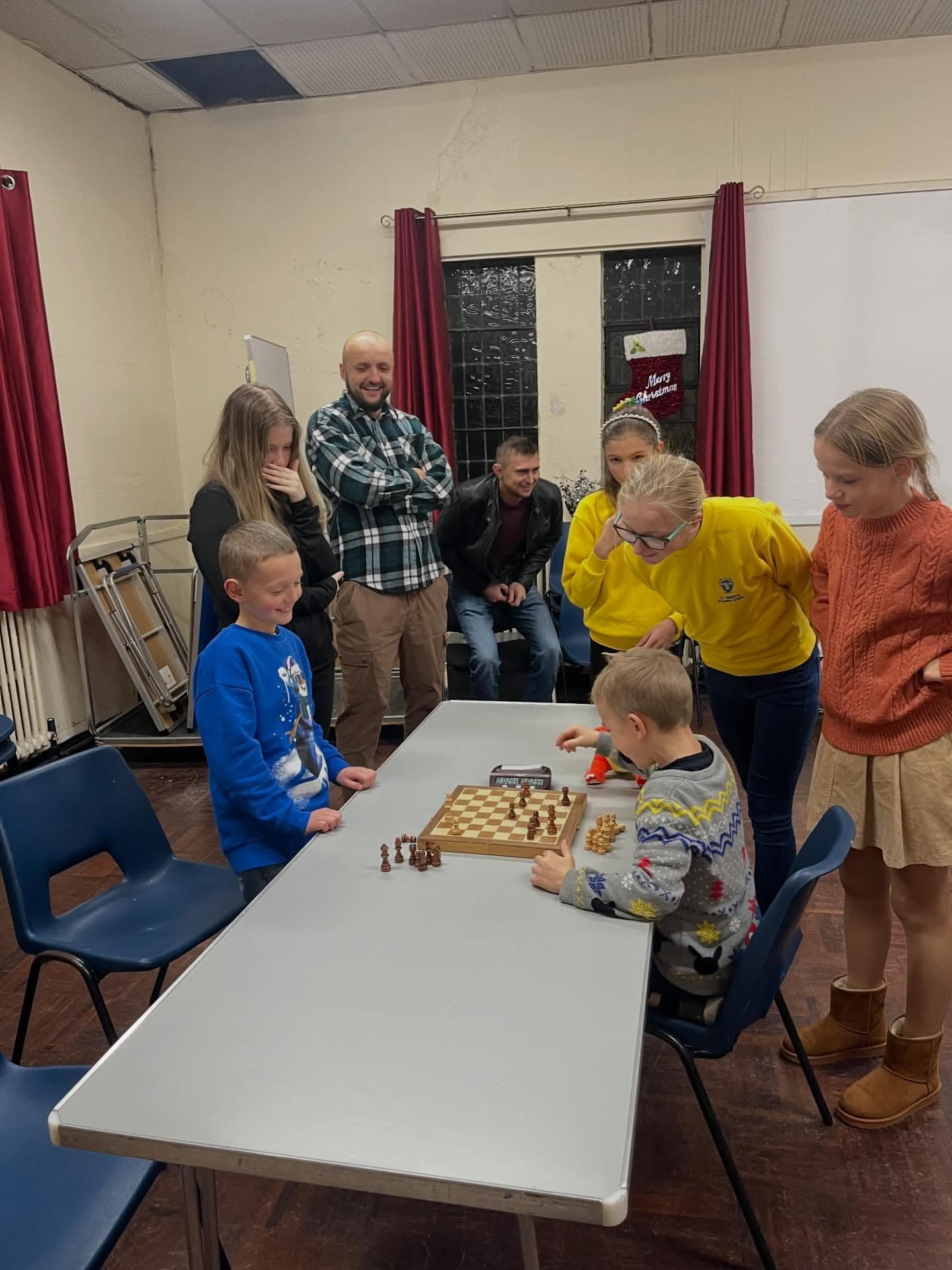 Chess4U class in Glasgow with children practising on the board